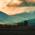 View of golden sunset sky shining on mountain range in countryside at South Island of New Zealand